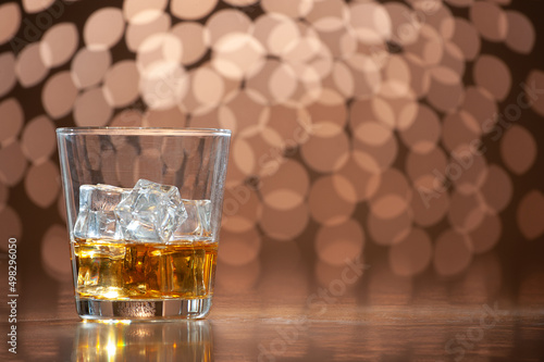 whiskey on the rocks on bokeh back ground with copy space