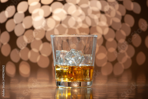 whiskey on the rocks on bokeh back ground