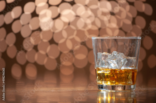 whiskey on the rocks on bokeh back ground with copy space
