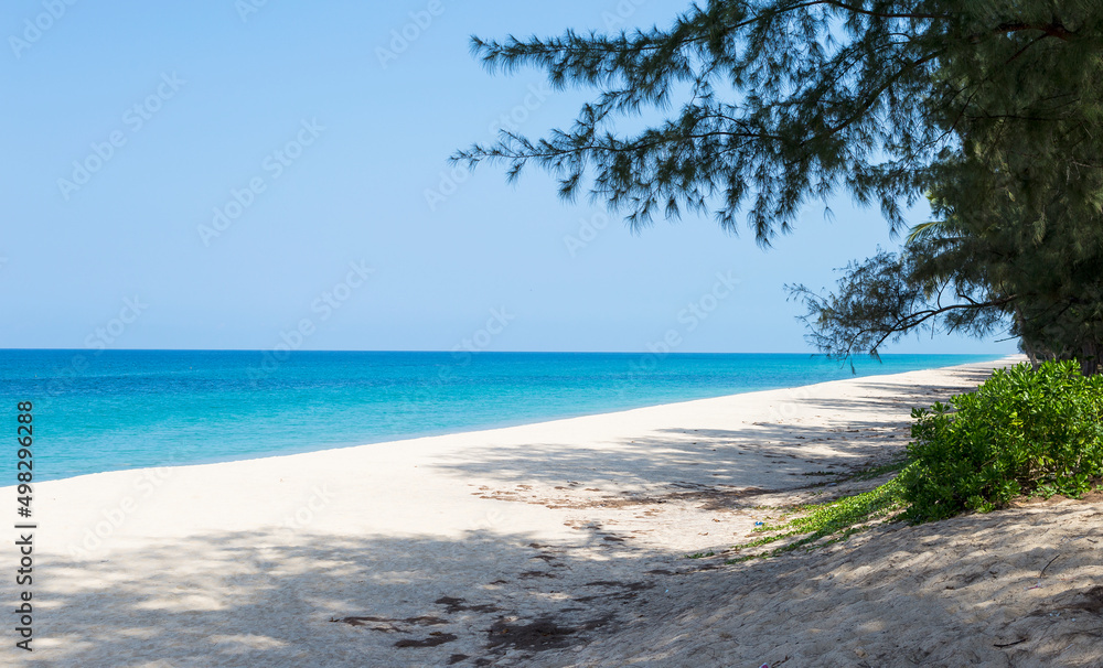 Fototapeta premium Long sandy beach, tropical island in south of Thailand, relaxing by the sea, summer holiday destination