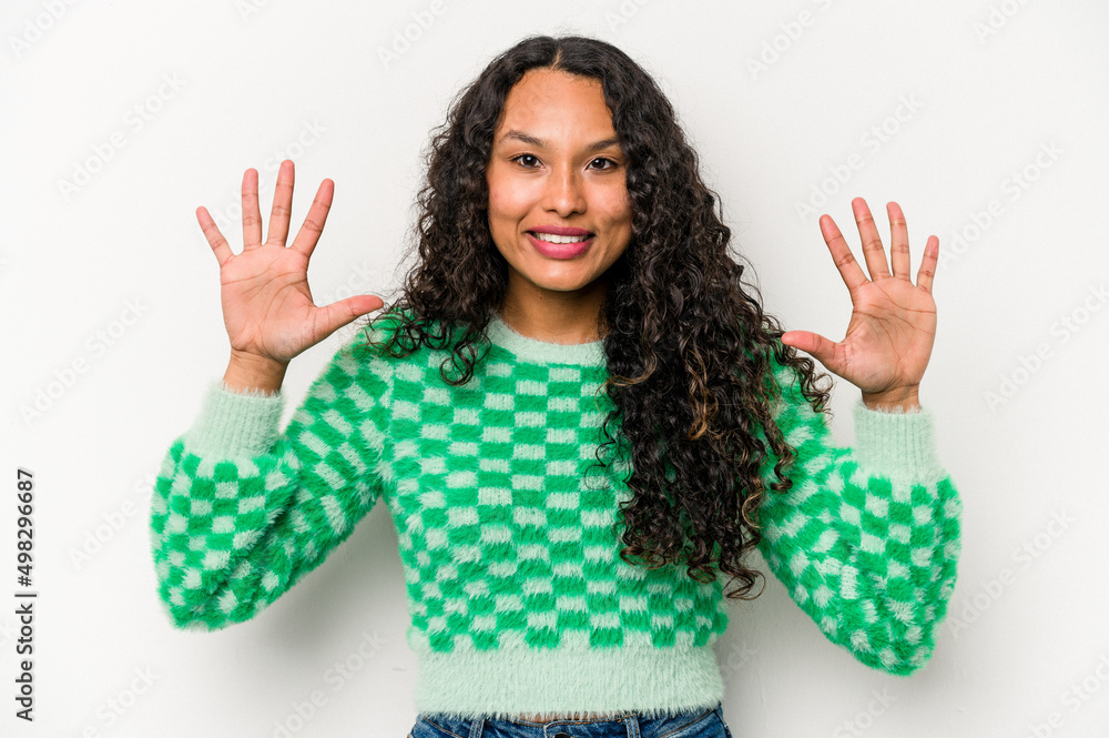 Young hispanic woman isolated on white background showing number ten with hands. Young hispanic woman isolated on white background showing number ten with hands.