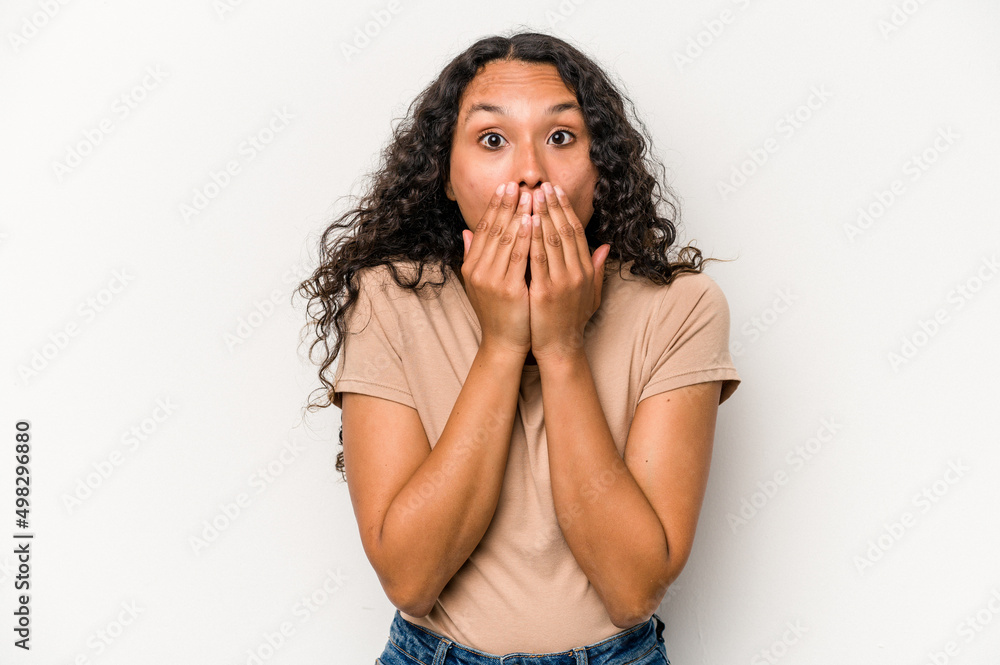 Young hispanic woman isolated on white background shocked covering mouth with hands. Young hispanic woman isolated on white background shocked covering mouth with hands.
