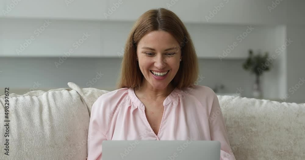 Happy woman check e-mail on laptop read message, feels overjoyed, celebrate fantastic great news, lottery win, huge discount, cool commercial offer, got hired, receive bank loan confirmation concept Happy woman check e-mail on laptop read message, feels overjoyed, celebrate fantastic great news, lottery win, huge discount, cool commercial offer, got hired, receive bank loan confirmation concept