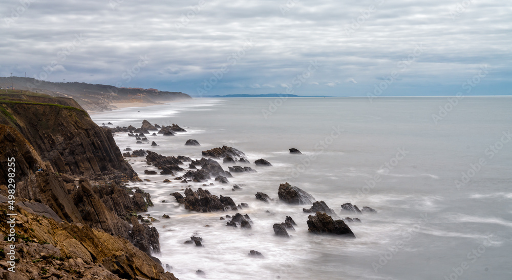 long exposure vertical view of rocky and wild coast on the Altlantic Ocean
