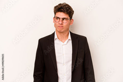 Young caucasian business man isolated on white background confused, feels doubtful and unsure.
