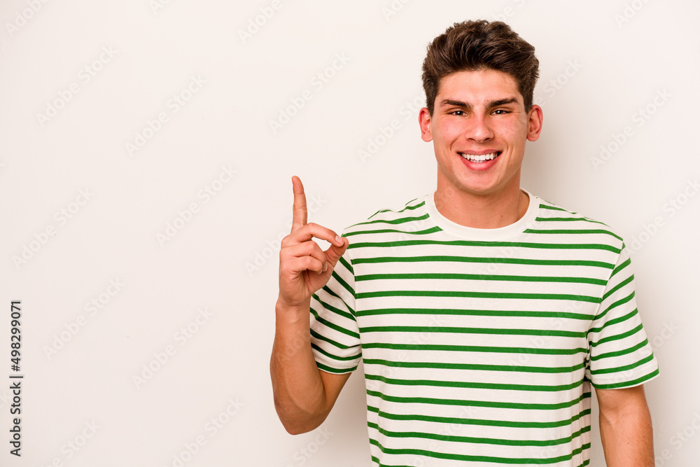 Young caucasian man isolated on white background showing number one with finger. Young caucasian man isolated on white background showing number one with finger.