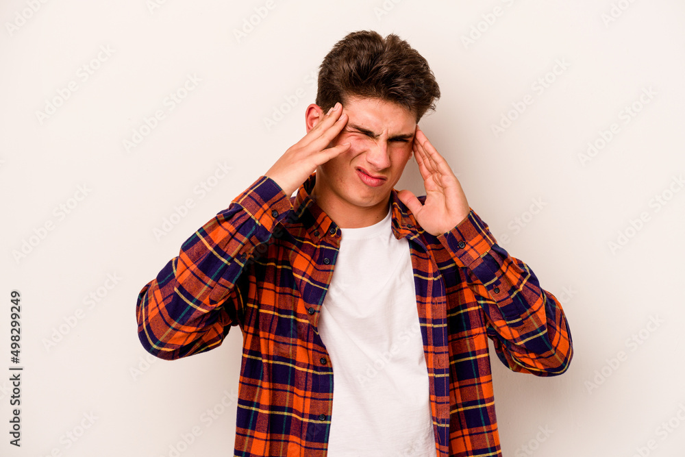 Young caucasian man isolated on white background touching temples and having headache. Young caucasian man isolated on white background touching temples and having headache.