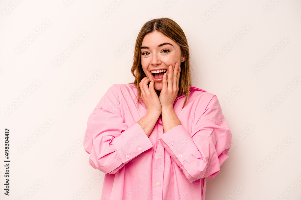 Young caucasian woman isolated on white background praying for luck, amazed and opening mouth looking to front. Young caucasian woman isolated on white background praying for luck, amazed and opening mouth looking to front.
