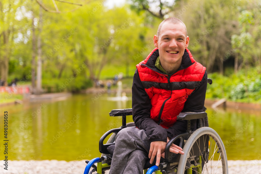 © unai - Portrait of a paralyzed young man in a public park in the city. Sitting in the wheelchair thoughtful © unai - Portrait of a paralyzed young man in a public park in the city. Sitting in the wheelchair thoughtful