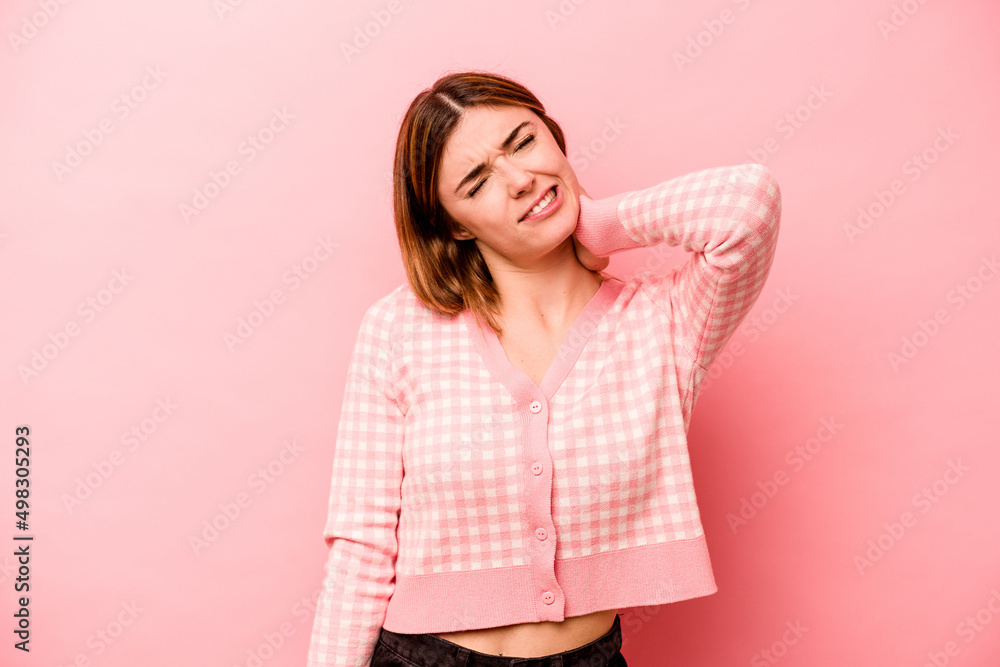 Young caucasian woman isolated on pink background suffering neck pain due to sedentary lifestyle. Young caucasian woman isolated on pink background suffering neck pain due to sedentary lifestyle.