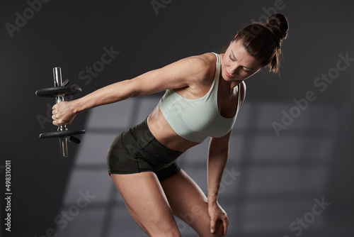 Фотография Woman doing triceps extensions