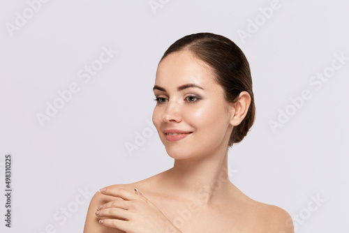 Healthy skin woman natural makeup beauty face closeup over gray background.