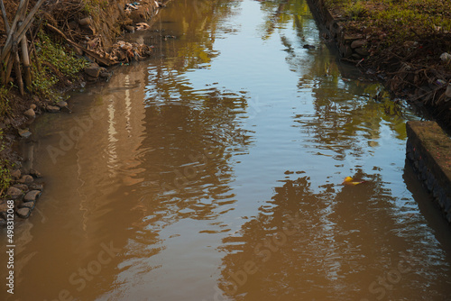 Obraz na plátně murky water in rural river