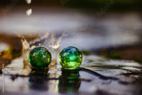 green globes on the wet floor © Photo Art