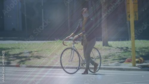Wallpaper Mural Animation of shapes moving over biracial woman with face mask walking with bicycle Torontodigital.ca