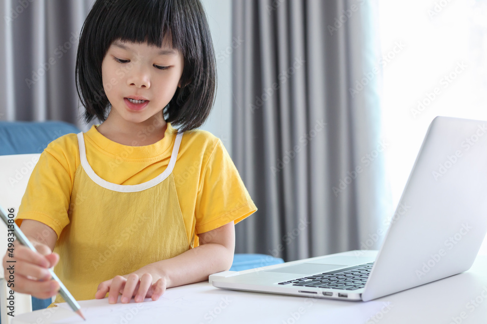 little asian girl student study online using laptop computer at home little asian girl student study online using laptop computer at home