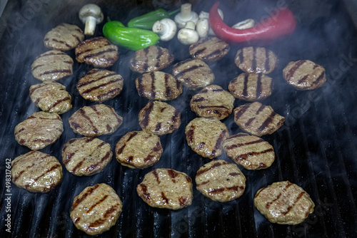 Turkish Food Kofte or Kofta .Cheddar meatballs Kebab. Grilled patties on charcoal. Preparing a batch of grilled or barbecue ground meat patties or frikadeller.