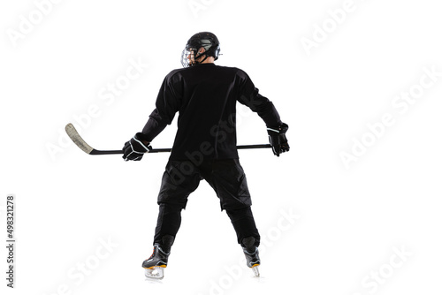 Back view portrait of professional hockey player in posing isolated over white studio background