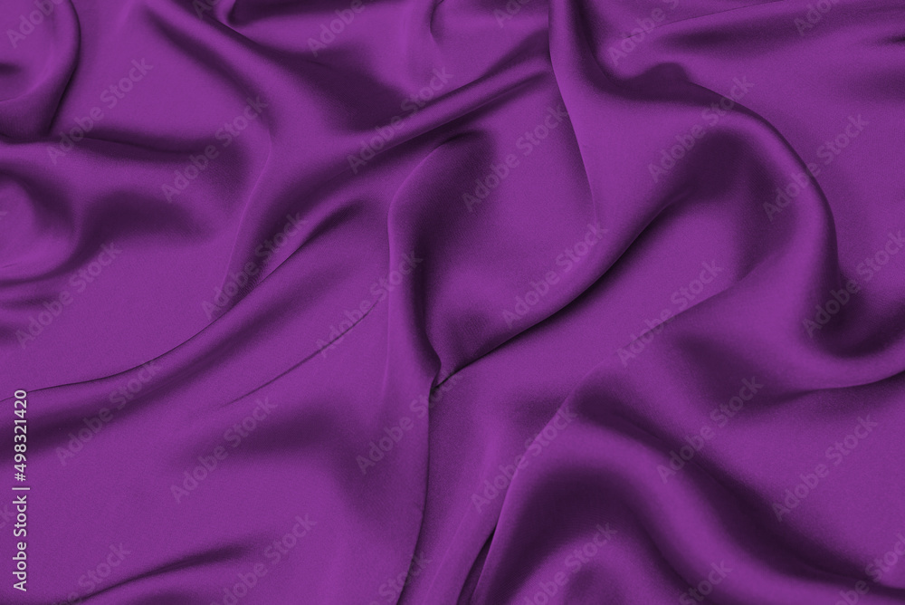 Fototapeta premium Purple silk or satin luxury fabric texture can use as abstract background.