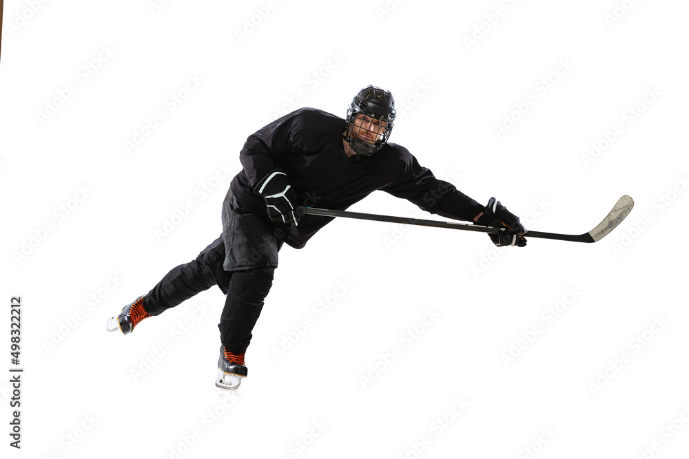 Winning game. Portrait of concentrated man, professional hockey player in motion, training isolated over white background. Winning game. Portrait of concentrated man, professional hockey player in motion, training isolated over white background.