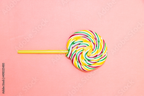 round lollipop candies isolated on pink background