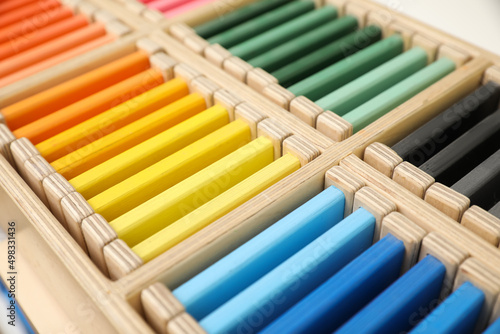 Wooden box with color tablets  closeup. Montessori toy