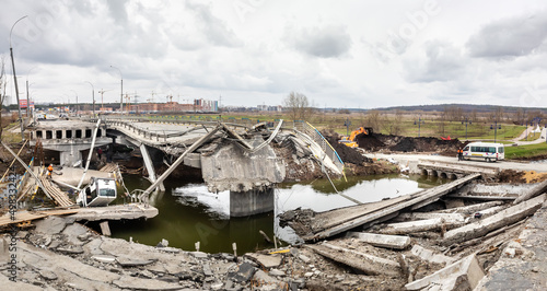 War in Ukraine. Destroyed Bridge Over The Irpin River photo