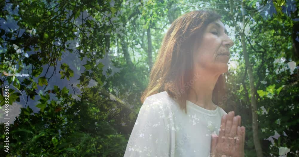 Animation of trees over senior caucasian woman practicing yoga and meditating Animation of trees over senior caucasian woman practicing yoga and meditating