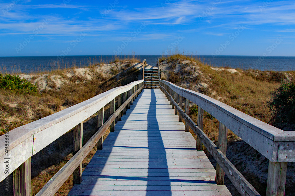 boardwalk over sand dunes at ocean beach