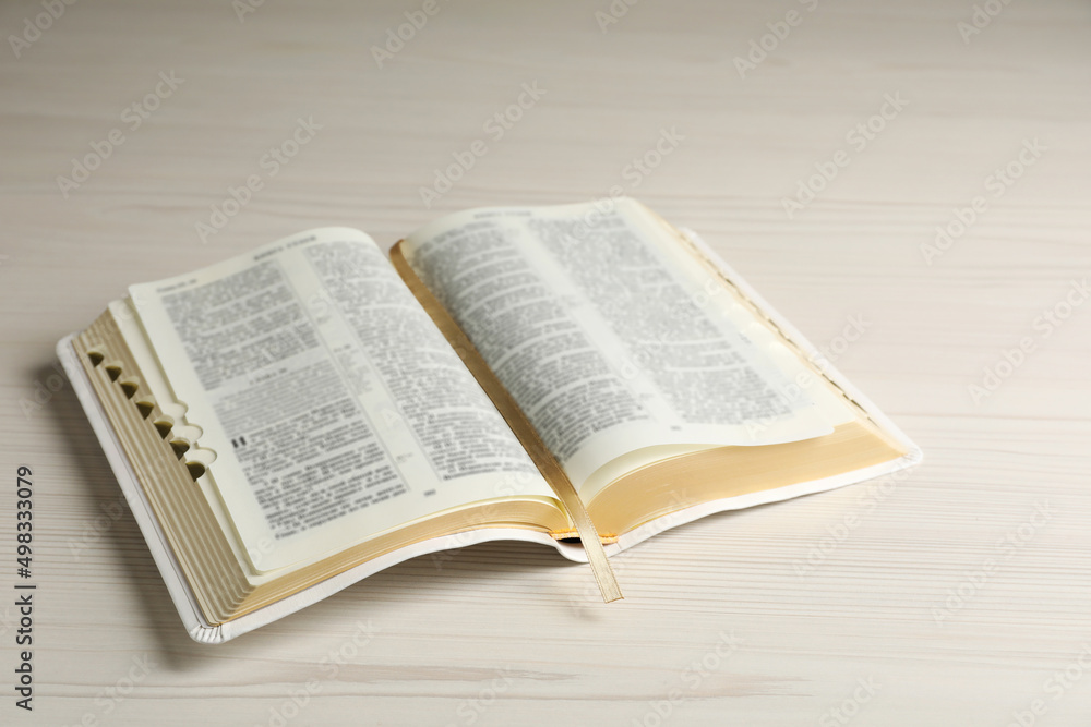 Open Bible on white wooden table. Christian religious book Open Bible on white wooden table. Christian religious book