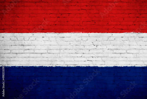 Netherlands flag painted on brick wall. National country flag background photo
