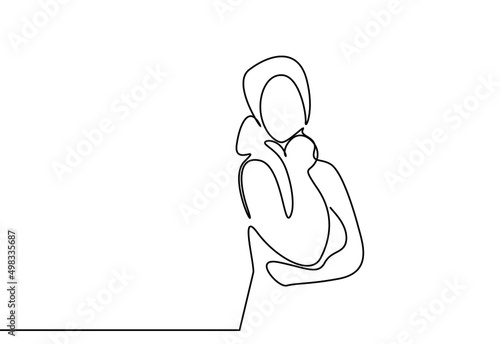 a person who sees her hand on her chin thinks deeply and tries to make a decision
