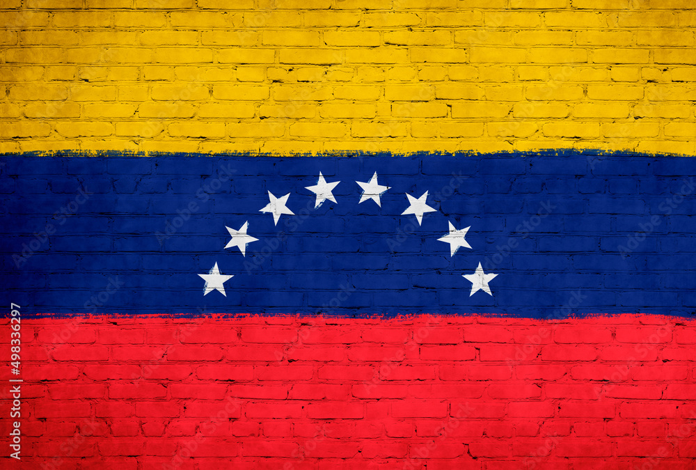 Venezuela flag painted on brick wall. National country flag background photo