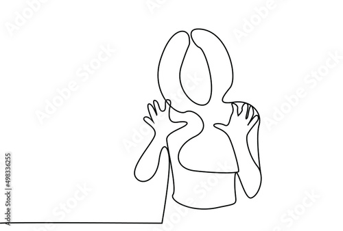 A scared woman raises her hands. a woman trying to scare a person