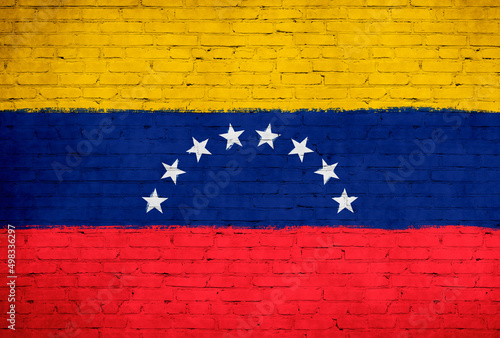 Venezuela flag painted on brick wall. National country flag background photo