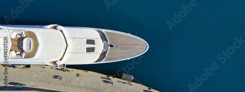 Aerial drone top view ultra wide panoramic photo with copy space of luxury yacht anchored in mediterranean port © aerial-drone