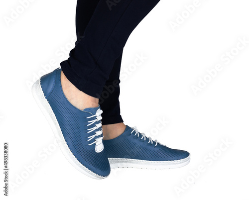 Women Black Leg Jeans and blue sports Sneakers isolated on white background