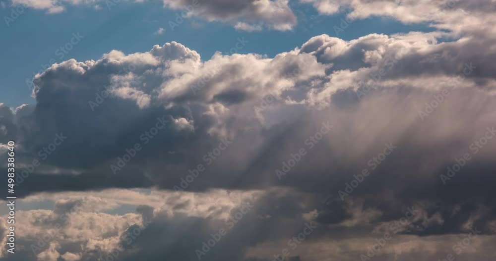 Timelapse of blue sky background with tiny striped clouds before storm with dark clouds Timelapse of blue sky background with tiny striped clouds before storm with dark clouds