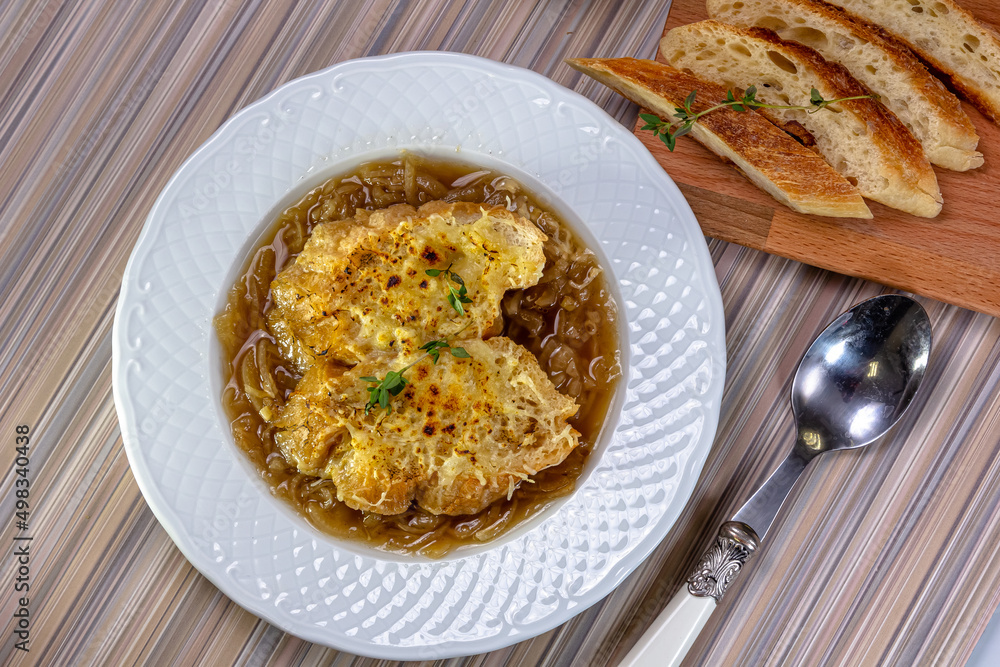 Classic French onion soup baked with cheese croutons Classic French onion soup baked with cheese croutons