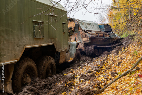 The truck got stuck on a dirty, broken forest road. Autumn thaw. Offroad