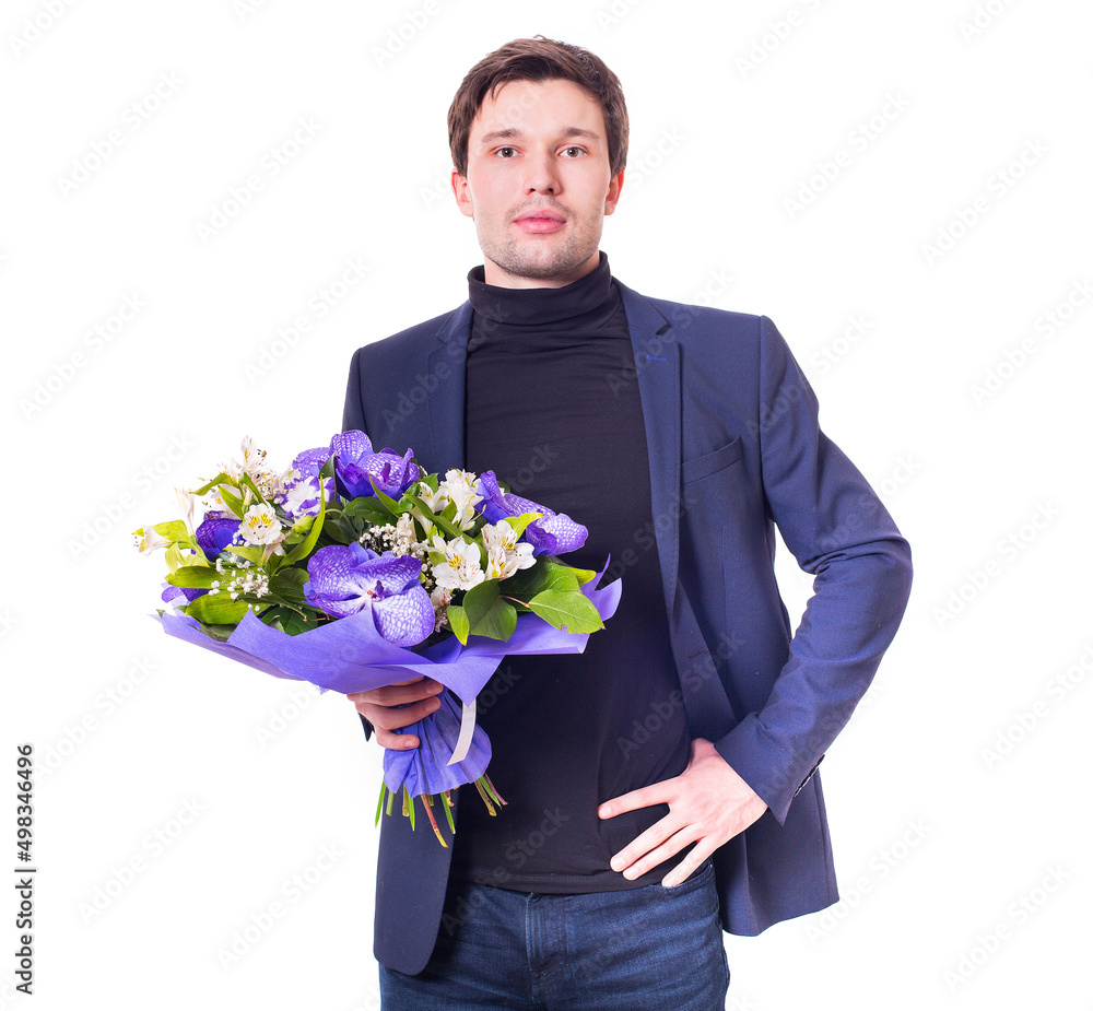 funny handsome young man with dark suit with a beautiful bouquet in the hands of white and purple flowers isolated on a white background funny handsome young man with dark suit with a beautiful bouquet in the hands of white and purple flowers isolated on a white background