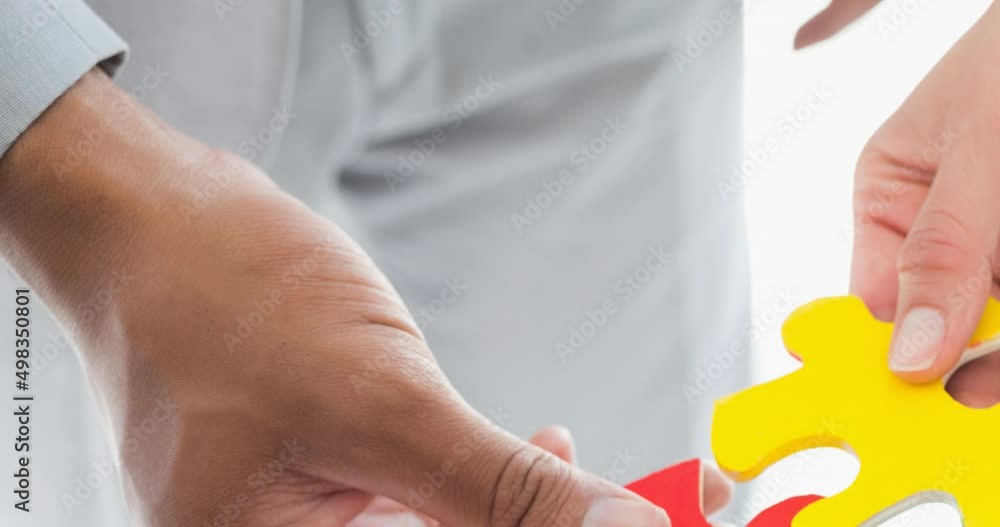 Animation of biracial man and caucasian woman playing puzzle Animation of biracial man and caucasian woman playing puzzle