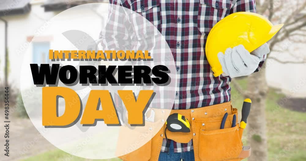 Animation of international workers day text over caucasian male worker with hammer and helmet Animation of international workers day text over caucasian male worker with hammer and helmet
