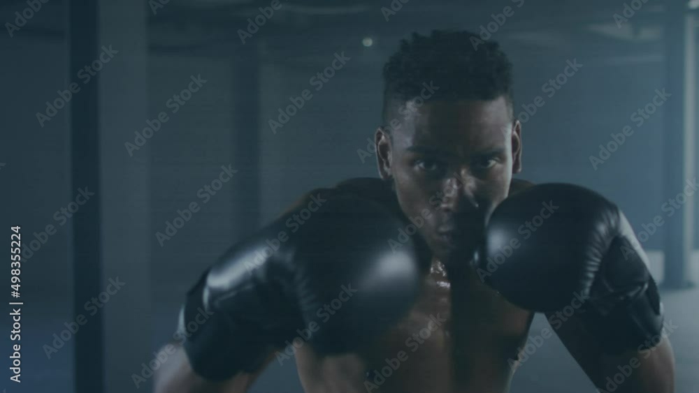 Animation of interference over biracial male boxer punching Animation of interference over biracial male boxer punching