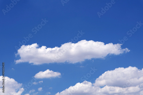 Pure White Clouds Floating on Vivid Blue Sunny Sky