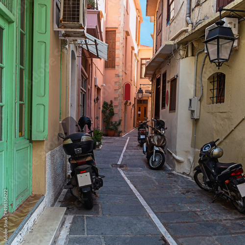 narrow cobbled street with parked motorcycles in the small Greek town of Rethymno