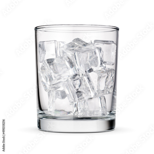 Glass with ice cubes isolated on white.