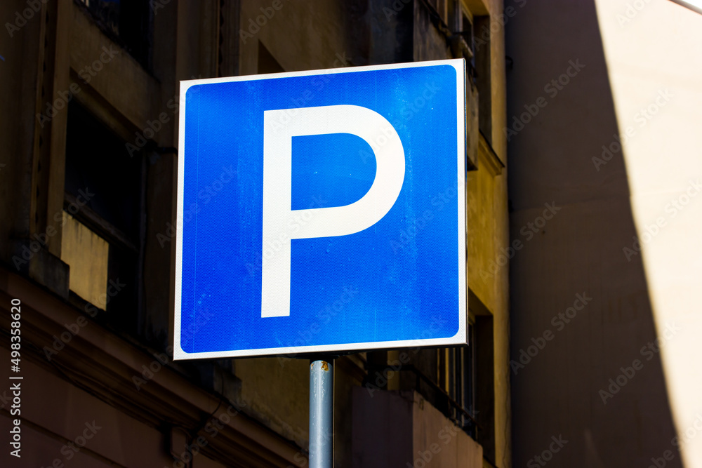 Parking sign. Square road parking sign for motorists in an urban environment. Parking zone. A place where it is allowed to park cars and other vehicles to get around. Big city infrastructure. Parking sign. Square road parking sign for motorists in an urban environment. Parking zone. A place where it is allowed to park cars and other vehicles to get around. Big city infrastructure.