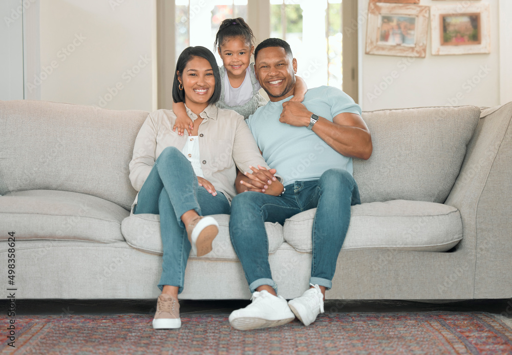 My parents are the best. Full length shot of a young couple sitting on their sofa at home with their daughter. My parents are the best. Full length shot of a young couple sitting on their sofa at home with their daughter.