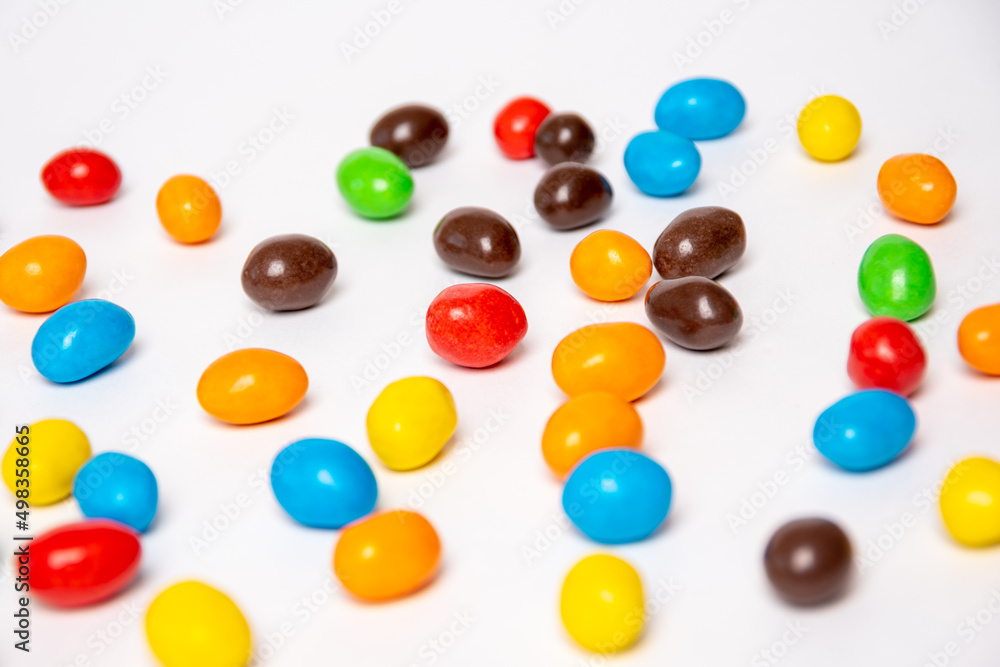 Background of colorful rainbow round candies, flat lay, top view. Treats for children. Sweet dessert for kids. Background of colorful rainbow round candies, flat lay, top view. Treats for children. Sweet dessert for kids.